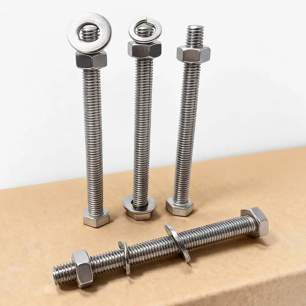 Four metal bolts on a cardboard surface with a white background｜card