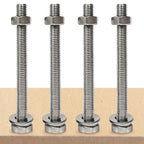 Four metal bolts with nuts on a wooden surface｜card